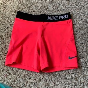 neon pink Nike Pro shorts